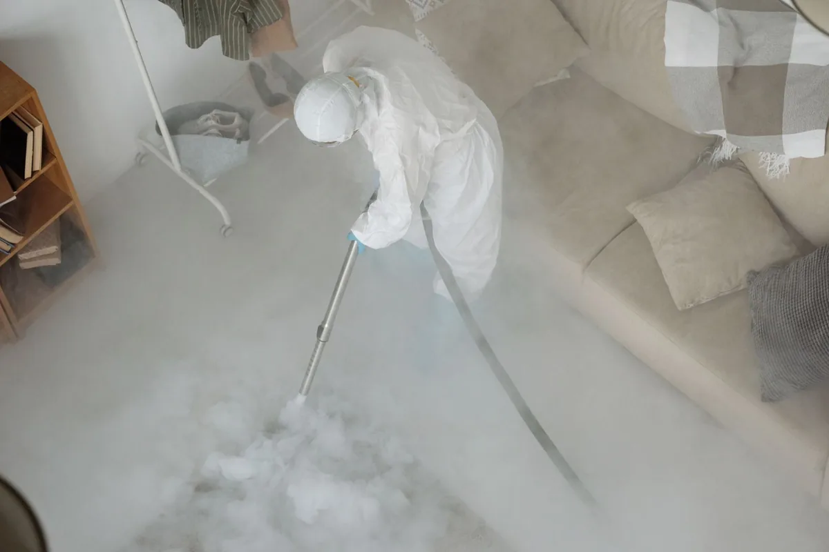 Biohazard cleanup technician in protective equipment, Richmond Place, Tampa, FL
